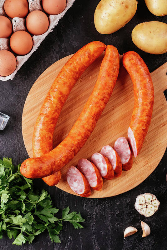 Appetizing Art Print featuring the photograph Fresh Homemade Sausage On A Dark Background With Vegetables #11 by Cavan Images