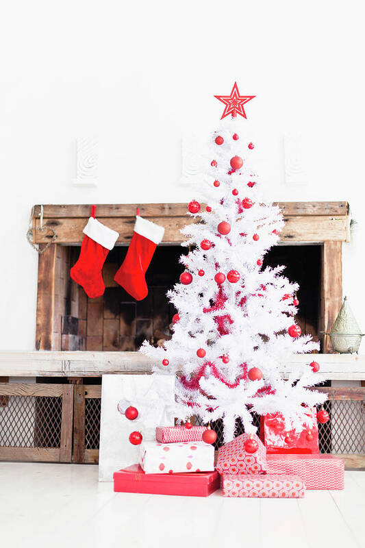 Holiday Art Print featuring the photograph Christmas Tree With Gifts And Stockings by Hybrid Images