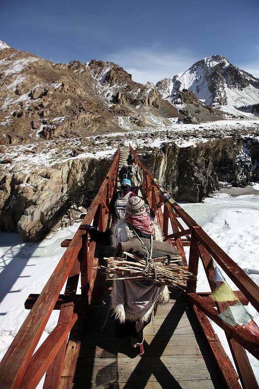 Asian And Indian Ethnicities Art Print featuring the photograph Family Crosses Bridge During Frozen by Timothy Allen