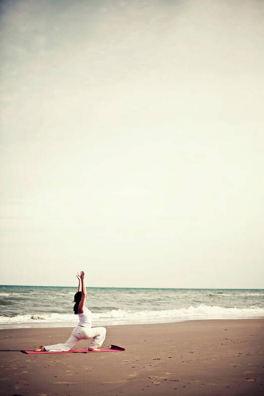 Water's Edge Art Print featuring the photograph Girl Practicing Yoga On The Beach by Lindaobrien Photography