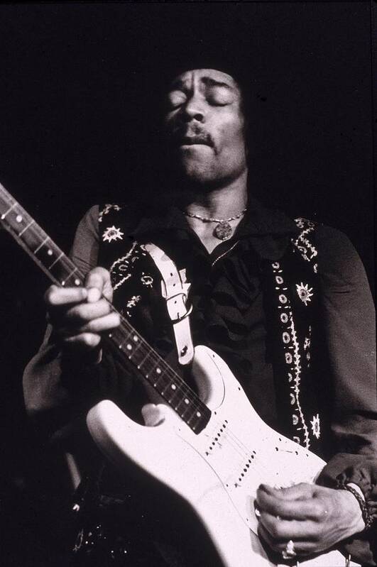 Rock And Roll Art Print featuring the photograph Jimi Hendrix Performs by Hulton Archive