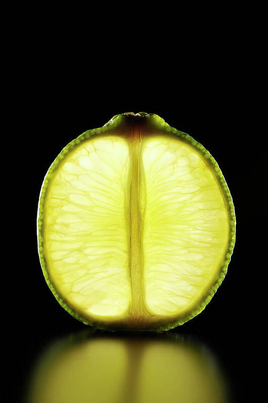 Black Background Art Print featuring the photograph Lime Slice Is Illuminated Black by Yagi Studio