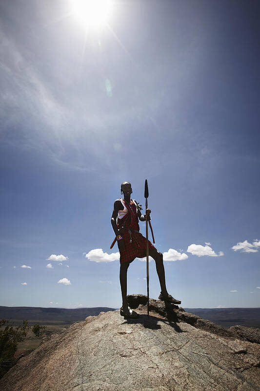 Young Men Art Print featuring the photograph Maasai Man Standing On Top Of Rock by Niels Busch