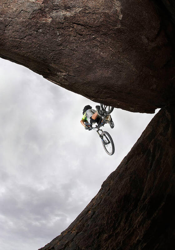 Recreational Pursuit Art Print featuring the photograph Mountain Bike Rider Jumping Over Gap by Thomas Northcut