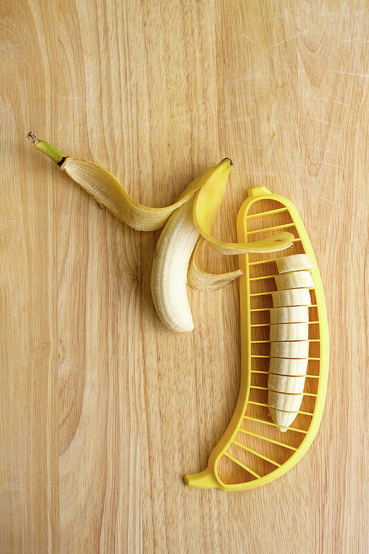 Cutting Board Art Print featuring the photograph Two Bananas On Cutting Board by Kelly Sillaste