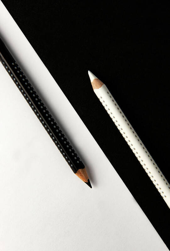 Pencil Art Print featuring the photograph Two drawing pencils on a black and white surface. by Michalakis Ppalis