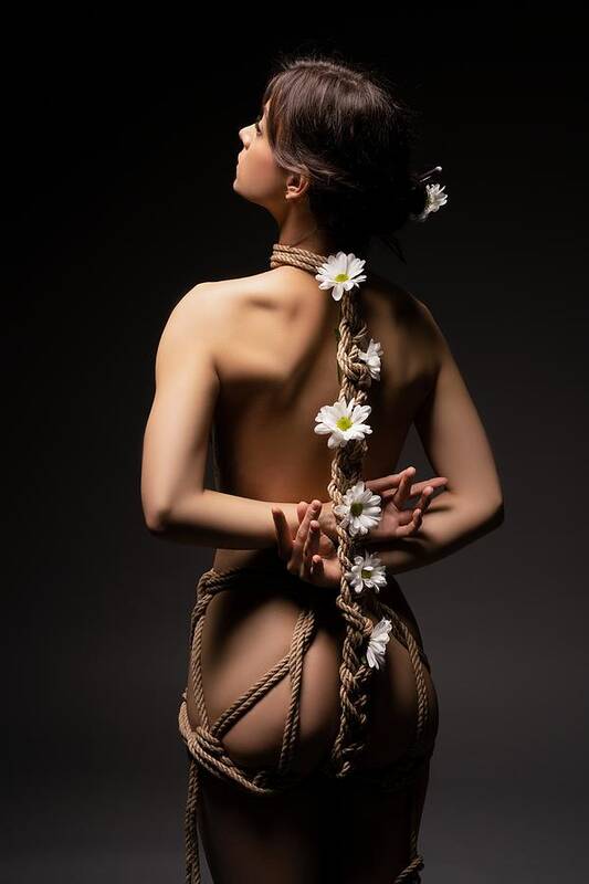 Woman Art Print featuring the photograph Woman Tied With Ropes And Flowers by Andrey Guryanov
