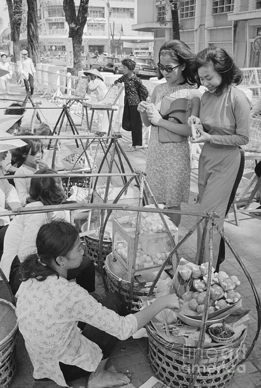 Ho Chi Minh City Art Print featuring the photograph Women Shopping At The Market by Bettmann