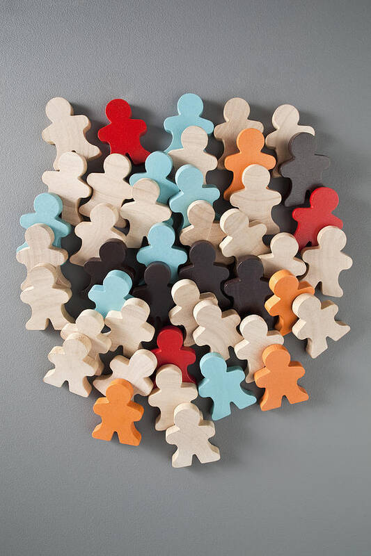 Part Of A Series Art Print featuring the photograph A group of multi colored wooden stick figures #1 by Charles Orr