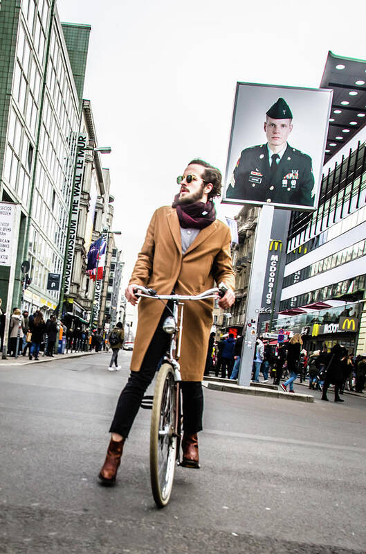 Berlin Art Print featuring the photograph Berlin Hipster on BIcycle at Checkpoint Charlie by Tito Slack