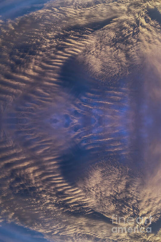 Clouds Art Print featuring the digital art Bronze colored clouds in the dark blue sky by Adriana Mueller