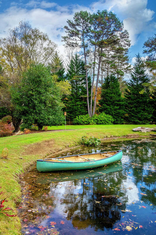 Boats Art Print featuring the photograph Canoe on the Edge of the Lake by Debra and Dave Vanderlaan