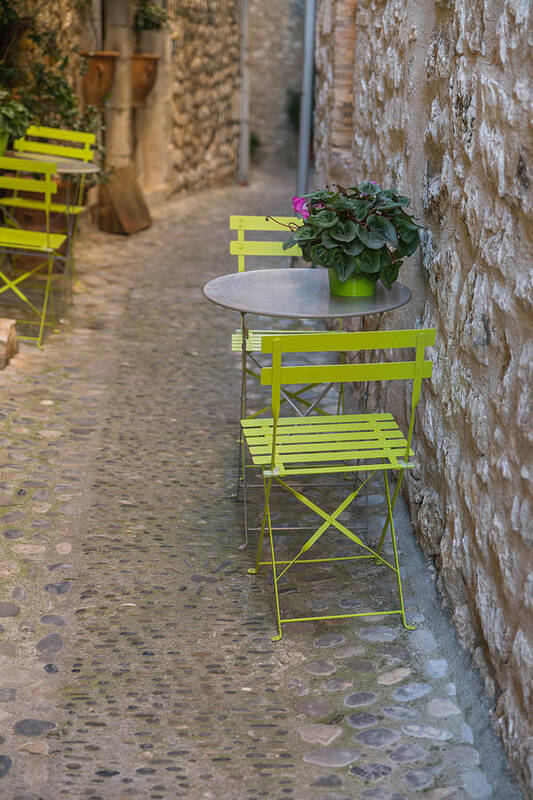 French Riviera Art Print featuring the photograph Chairs and tables on a typical village's street by Jean-Marc PAYET