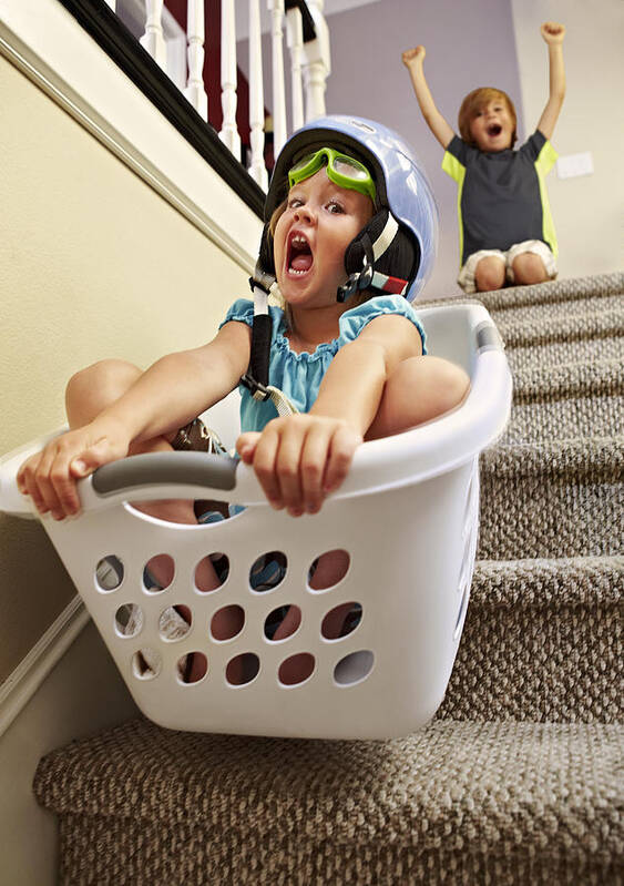 Steps Art Print featuring the photograph Girl going down stairs in laundry basket by Tony Garcia