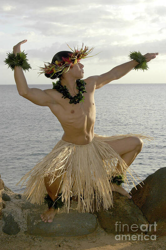 Beach Art Print featuring the photograph Male Hula Dancer poses on the beach in a traditional sun worship move. by Gunther Allen