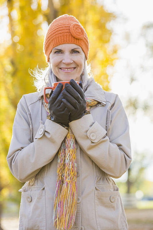 Provo Art Print featuring the photograph Older Caucasian woman drinking coffee near autumn trees by Mike Kemp