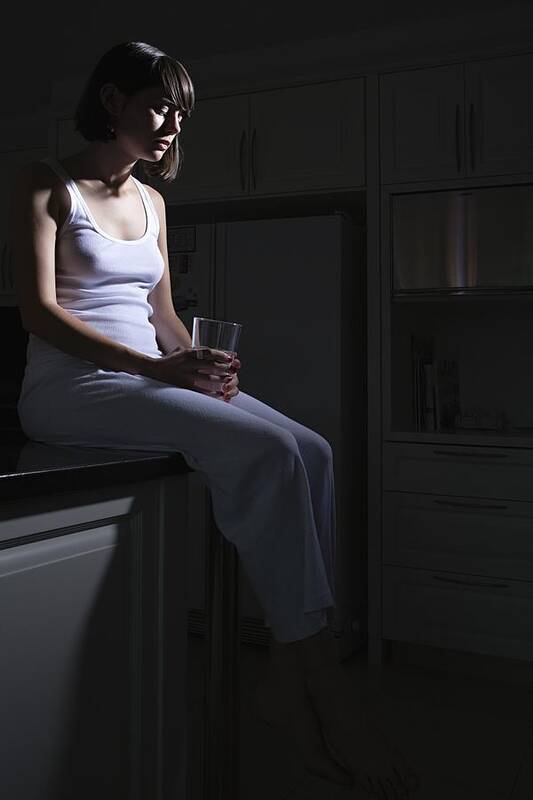 Shadow Art Print featuring the photograph Teenage girl sitting on kitchen counter by Image Source