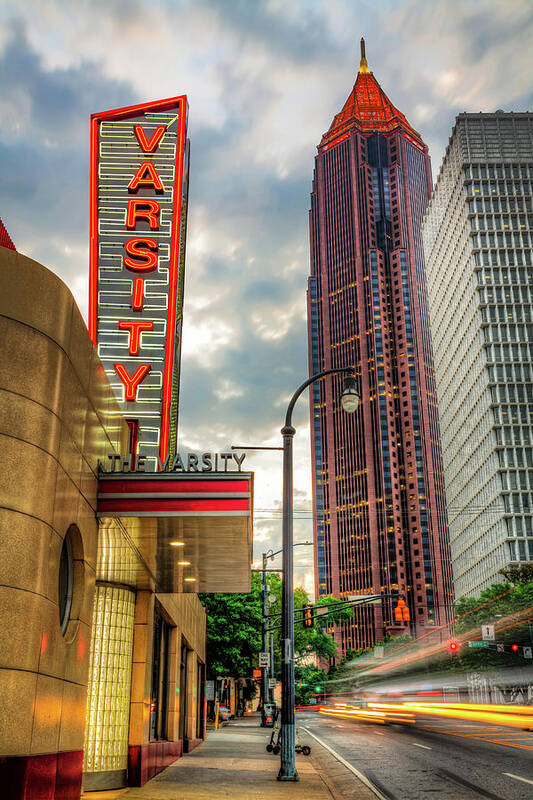 Atlanta Skyline Art Print featuring the photograph Glowing Neon And Passing Light Trails By An Iconic Eatery In Atlanta Georgia by Gregory Ballos