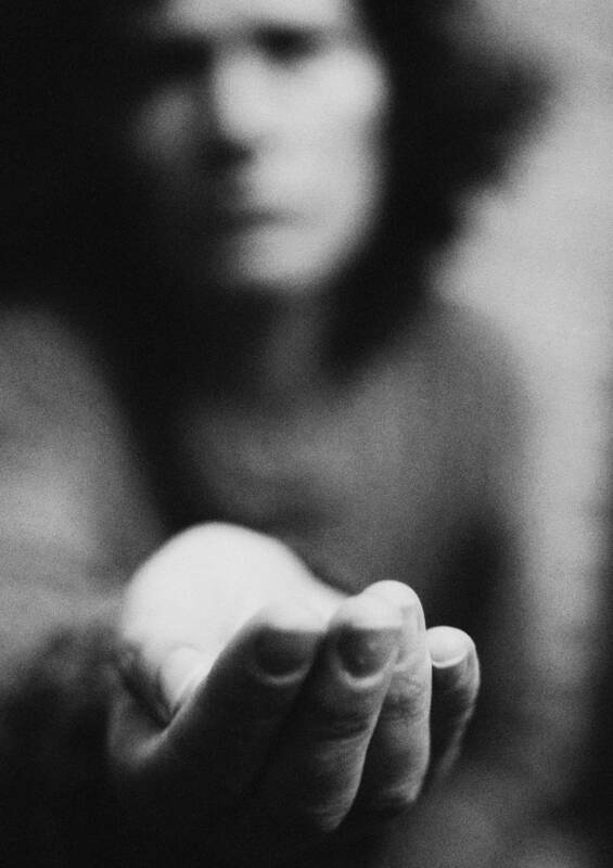 Debt Art Print featuring the photograph Woman holding hand out, blurred, b&w by Laurent Hamels
