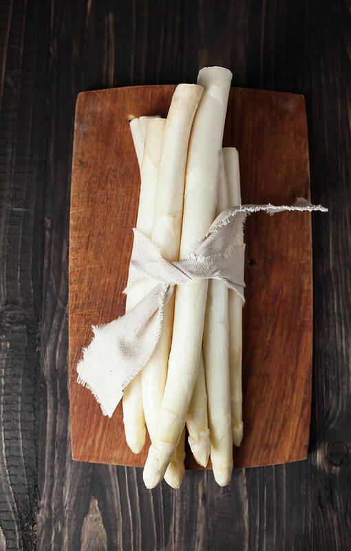 Cutting Board Art Print featuring the photograph Bunch Of White Asparagus On Chopping by Westend61