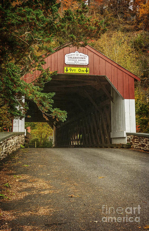 (day Or Daytime); (dirt Road Or Dirt Path); (scenery Or Scenic); (serene Or Serenity); Ambiance; Antique; Atmospheric; Autumn; Autumn Leaves; Bridge; Bucks County; Charming; Classic; Colorful; Colourful; Countryside; Covered Bridge; Fall; Fall Foliage; Foliage; Historic; Idyllic; Nostalgic; Old; Orange; Outdoors; Peaceful; Pennsylvania; Placid; Quaint; Quiet; Romantic; Rural; Rural Road; Rustic; Tranquil; Trees; Weathered; Wood; Yellow Art Print featuring the photograph Uhlerstown Bridge II by Debra Fedchin