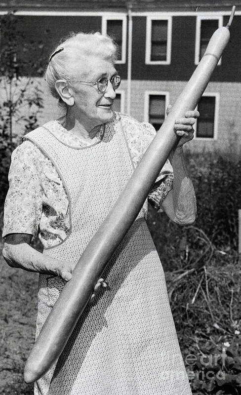People Art Print featuring the photograph Elderly Woman Holding Gigantic Bean by Bettmann