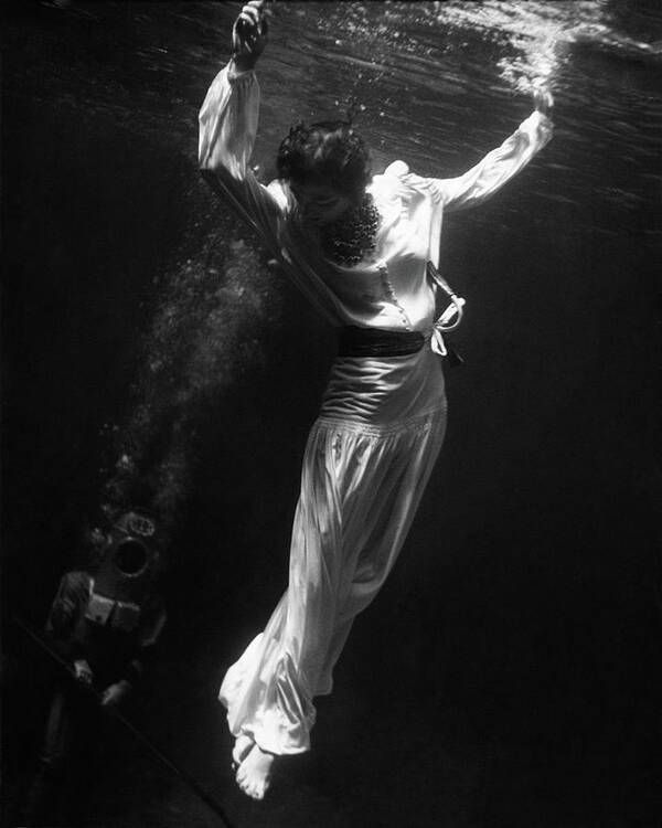 Exterior Art Print featuring the photograph A Model Wearing A Dress Underwater by Toni Frissell