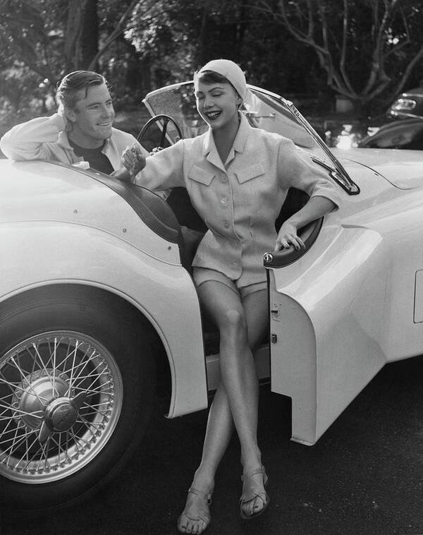 Two People Art Print featuring the photograph A Young Model Sitting In A Convertible Sports Car by Karen Radkai