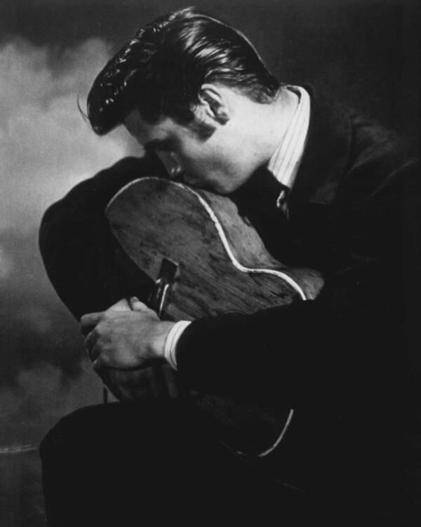 Classic Art Print featuring the photograph Elvis Presley Kisses Guitar by Retro Images Archive
