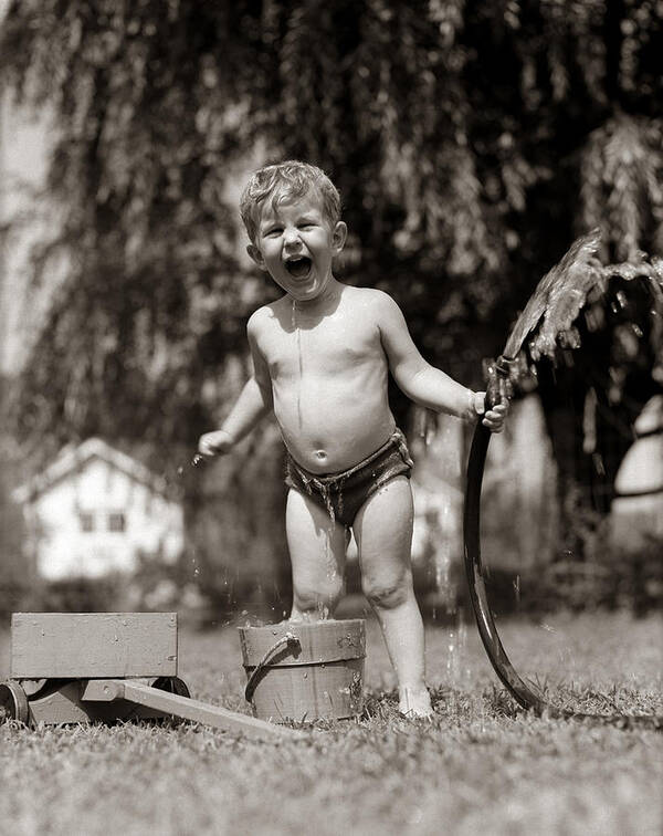 1940s Art Print featuring the photograph Little Boy Playing With Hose, C.1940-50s by H. Armstrong Roberts/ClassicStock