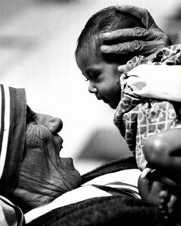 Classic Art Print featuring the photograph Mother Teresa Holds Baby by Retro Images Archive