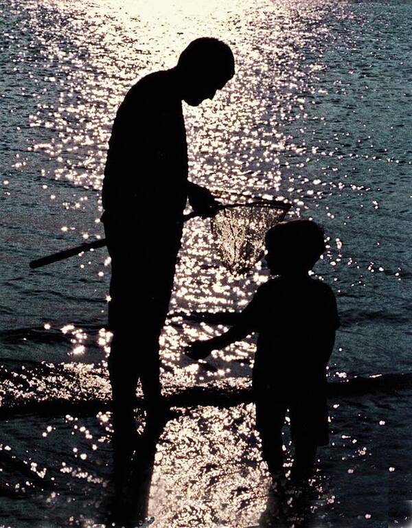 Father And Son . Silhouettes Against Sundown Art Print featuring the photograph Treasure by Edward Shmunes