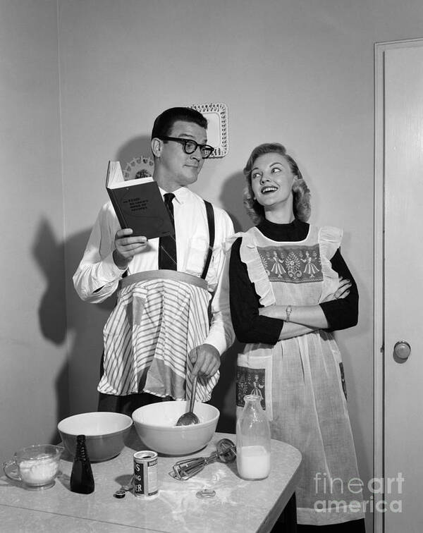 1950s Art Print featuring the photograph Husband Trying To Cook While Wife Looks by Debrocke/ClassicStock