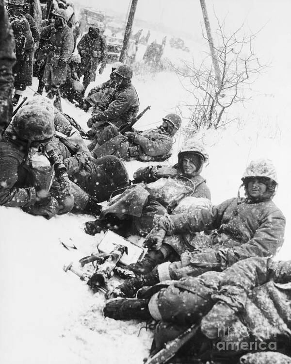 Korea Art Print featuring the photograph American Marines Rest In Snow In Korea by Bettmann