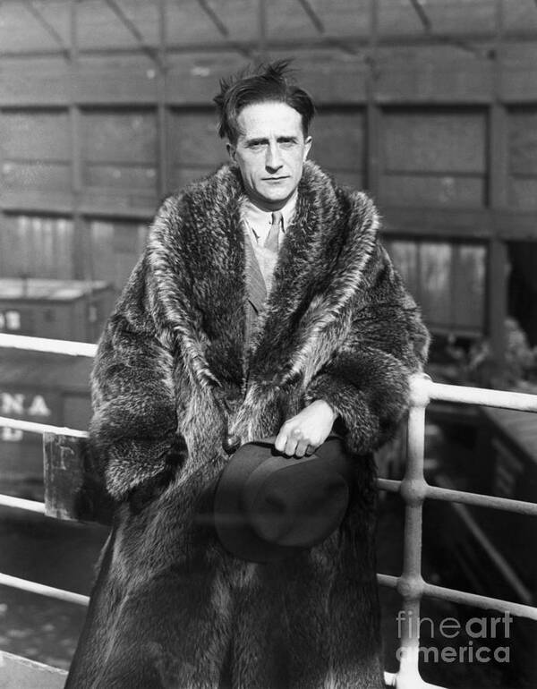 Fedora Art Print featuring the photograph Artist Marcel Duchamp Wearing Fur Coat by Bettmann