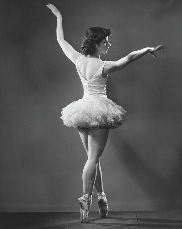 Ballet Dancer Art Print featuring the photograph Ballerina In Tutu Dancing In Studio by George Marks