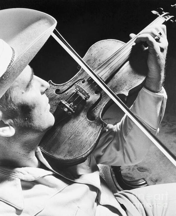 Country And Western Music Art Print featuring the photograph Bob Wills Playing Fiddle by Bettmann