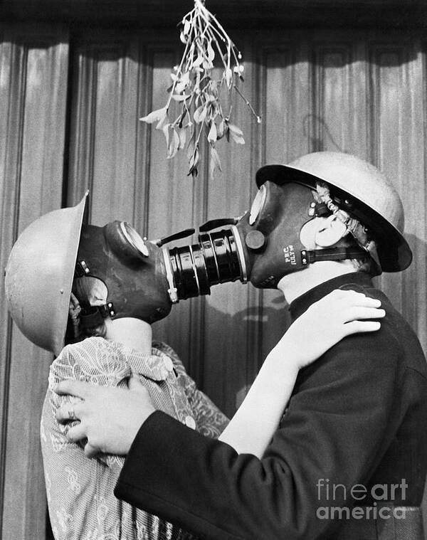 Air Attack Art Print featuring the photograph Couple Kissing Through Gas Masks by Bettmann