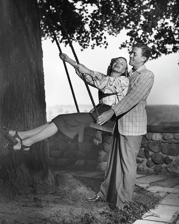 Heterosexual Couple Art Print featuring the photograph Couple Wwoman On Swing by George Marks