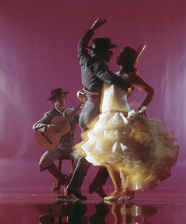 Hand Raised Art Print featuring the photograph Guitarist Playing Guitar And Couple by Tom Kelley Archive