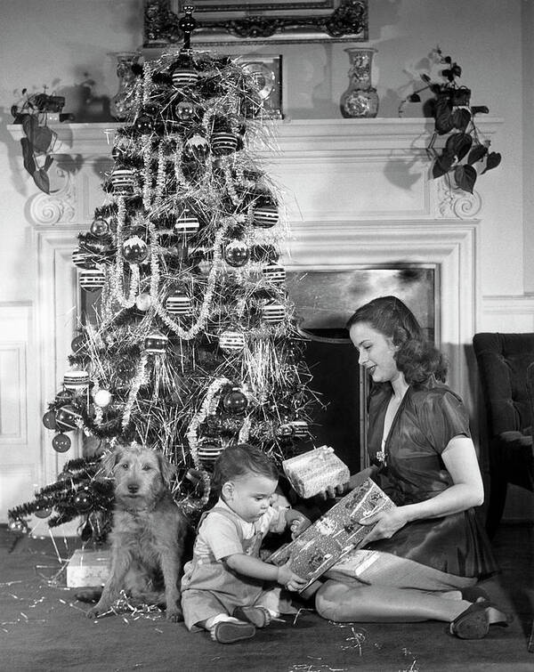 Pets Art Print featuring the photograph Mother And Child Opening Christmas Gifts by George Marks