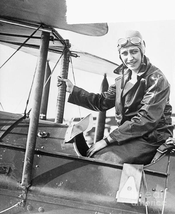 Mid Adult Women Art Print featuring the photograph Pilot Amy Johnson In Airplane Cockpit by Bettmann