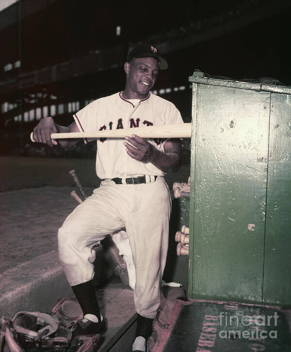 People Art Print featuring the photograph Willie Mays Placing A Bat Into The Bat by Bettmann