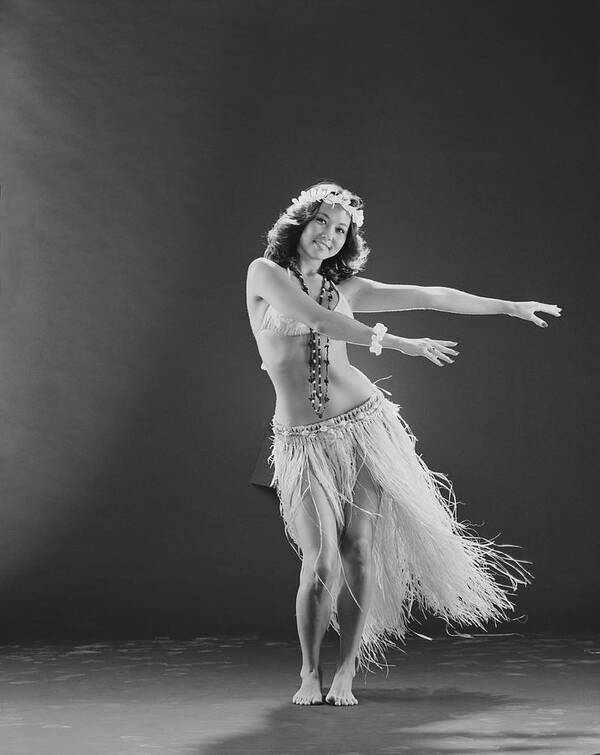 People Art Print featuring the photograph Young Woman Hula Dancer Dancing On by Tom Kelley Archive