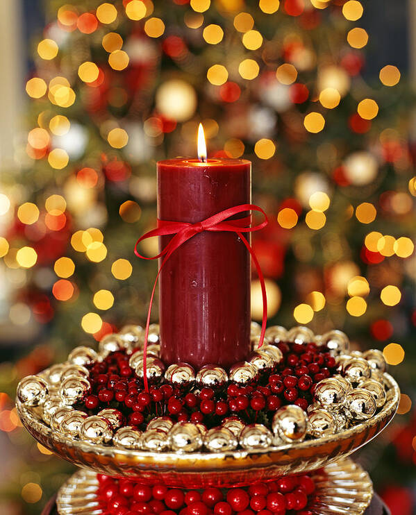 Christmas Ornament Art Print featuring the photograph Candle placed in the center of some sweets arranged in a bowl by Michel Arnaud