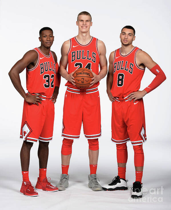 Kris Dunn Art Print featuring the photograph Zach Lavine, Kris Dunn, and Lauri Markkanen by Randy Belice