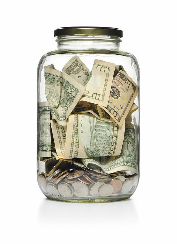 Charity Benefit Art Print featuring the photograph A clear glass jar filled with cash and coins by EasyBuy4u