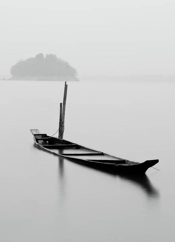 Scenics Art Print featuring the photograph Abandoned Boat Chained To A Bamboo Pole by Photo By Kinshuk Kashyap
