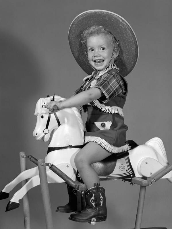 1950s Art Print featuring the photograph Cowgirl On Rocking Horse, C.1950s by B. Taylor/ClassicStock
