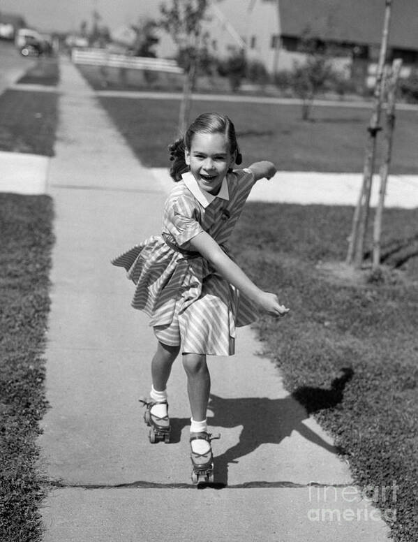1950s Art Print featuring the photograph Little Girl Roller-skating On Sidewalk by Debrocke/ClassicStock